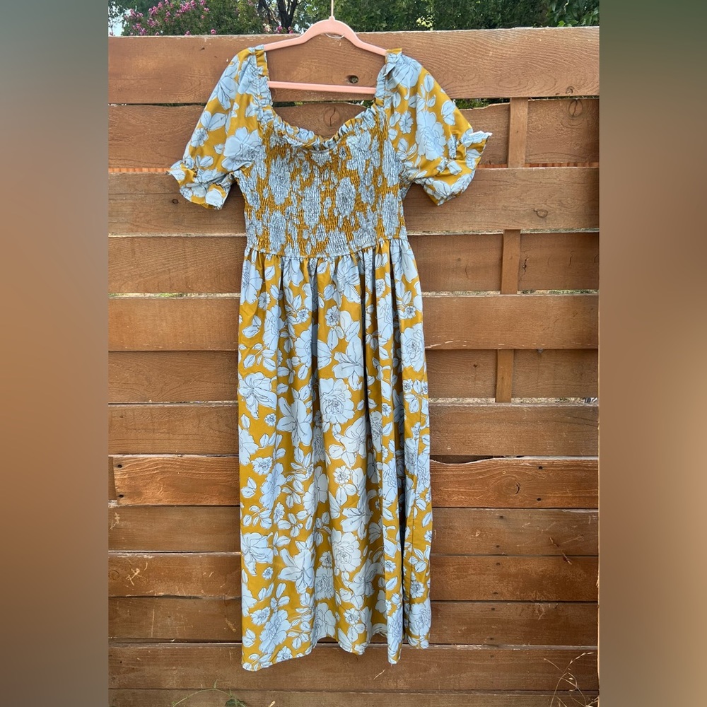 Plus size floral maxi dress with smocked bodice and off the shoulder sleeves